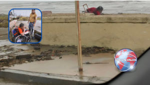 Auxilian a hombre en silla de ruedas atrapado en la arena de la playa durante intensa lluvia en Coatzacoalcos